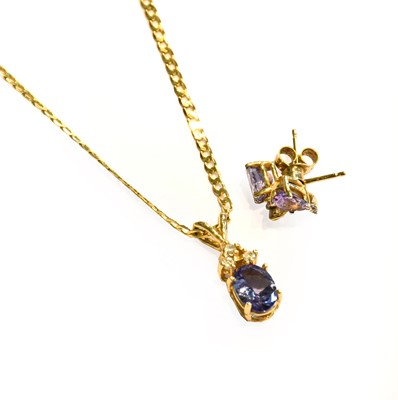 Lot 276 - A tanzanite and diamond pendant on chain,...