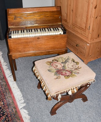 Lot 1210 - An early 20th century oak cased Harmonium, a...