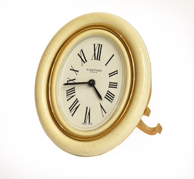 Lot 71 - An enamel alarm strut timepiece signed Cartier,...