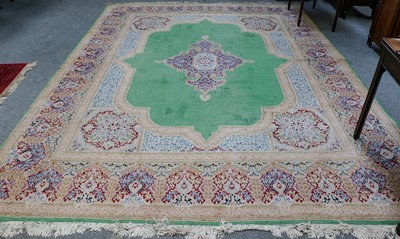 Lot 1117 - Kirman carpet, the apple green field with...