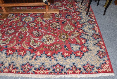 Lot 1121 - Oriental carpet, the soft raspberry field of...