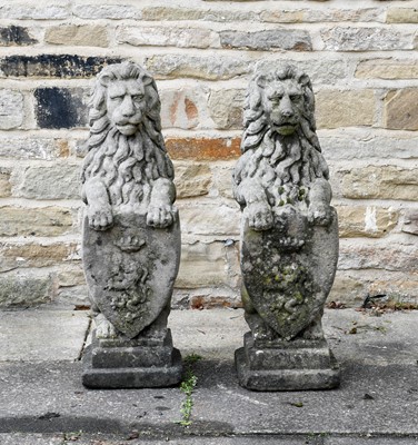 Lot 523 - A Pair of Sandstone Figures of Heraldic Lions,...