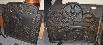 Lot 1131 - A cast iron fire back, decorated with rose,...