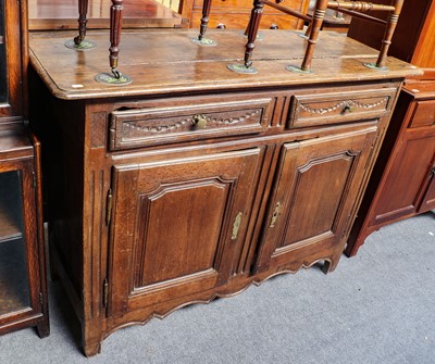 Lot 1239 - An 18th-century continental oak sideboard,...