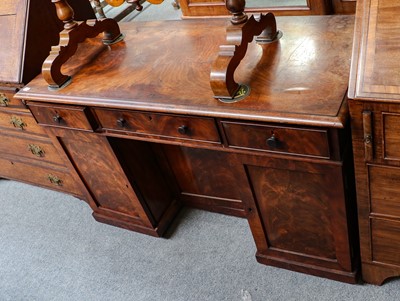 Lot 1085 - A George III mahogany kneehole desk, 121cm by...