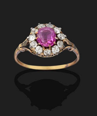 Lot 2351 - A Pink Sapphire and Diamond Cluster Ring