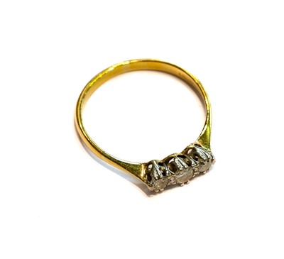Lot 203 - A diamond three stone ring, stamped '18CT',...