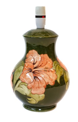 Lot 22 - A Moorcroft pottery table lamp in the Hibiscus...