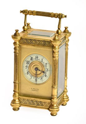 Lot 69 - A brass carriage timepiece, retailed by E....