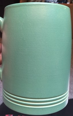 Lot 36 - A Wedgwood green glazed Art Deco jug designed...