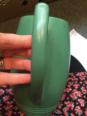Lot 36 - A Wedgwood green glazed Art Deco jug designed...