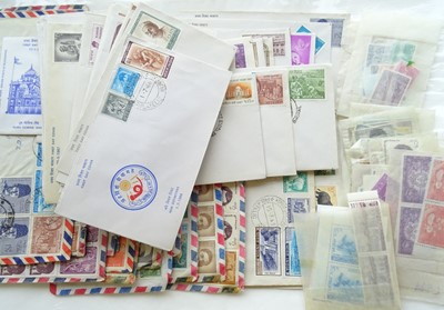 Lot 213 - Two boxes and a container of 1000s of stamps...