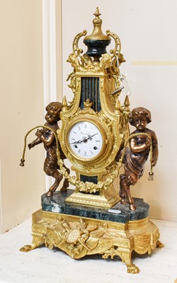 Lot 322 - A 20th-century large mantel clock, ornately...