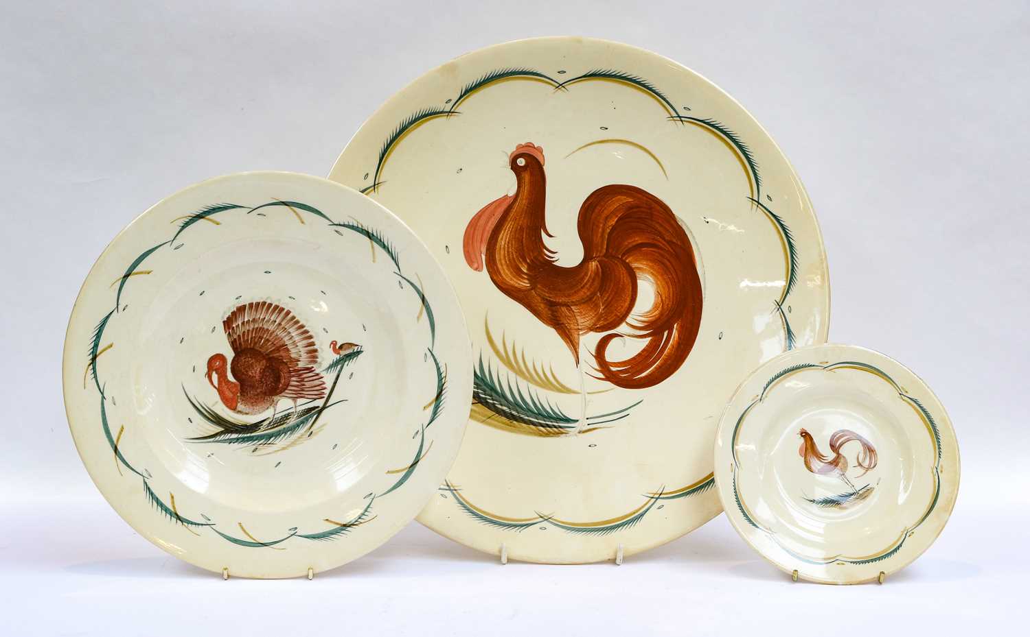 Lot 132 - Susie Cooper plates including a large serving...