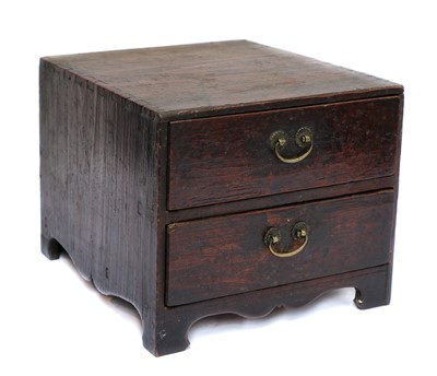 Lot 44 - A two drawer Chinese table top cabinet,...
