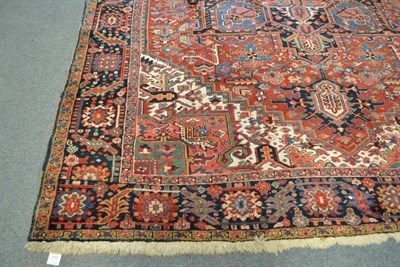 Lot 1091 - Heriz Carpet  Persian Azerbaijan The madder field of angular vines around a typical salmon...