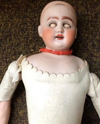Lot 359 - Bisque shoulder head doll with sleeping eyes,...