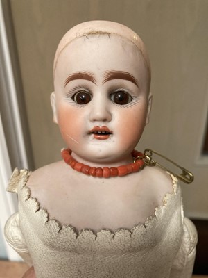 Lot 359 - Bisque shoulder head doll with sleeping eyes,...