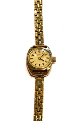 Lot 256 - A lady's 14 carat gold wristwatch, signed...
