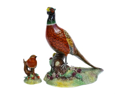 Lot 143 - A Royal Crown Derby model of a pheasant raised...