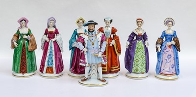 Lot 141 - A set of seven Sitzendorf figures, Henry VIII...