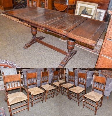 Lot 1248 - A 20th century oak draw-leaf extending dining...