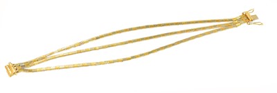 Lot 245 - An 18 carat gold bi-colour bracelet, length 17....
