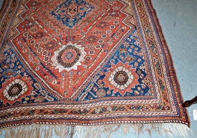 Lot 1095 - Kashgai Rug  South West Persia The serrated madder field centred by an indigo stepped medallion and