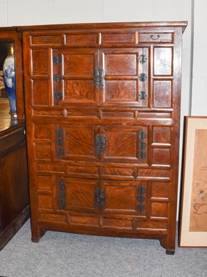 Lot 1152 - A 20th century Korean elm cabinet, with two...