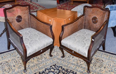 Lot 1169 - A pair of 1920's mahogany bergere chairs