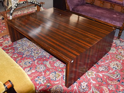 Lot 1142 - A modern macassar ebony veneered table, 150cm...