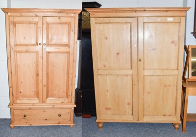 Lot 1190 - A modern pine wardrobe, with two doors one...