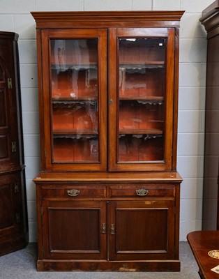 Lot 1070 - An early 20th century bookcase with glazed...
