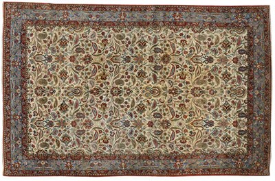 Lot 1098 - Ghom Carpet Central Persia The cream field of leafy vines and palmettes enclosed by sky blue...