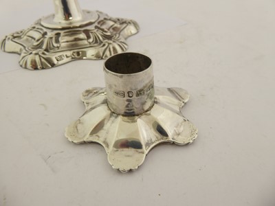 Lot 2101 - A Pair of George IV Silver Candlesticks