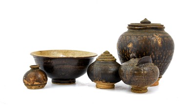 Lot 26 - A Khmer Stoneware Jar, 14th century, modelled...