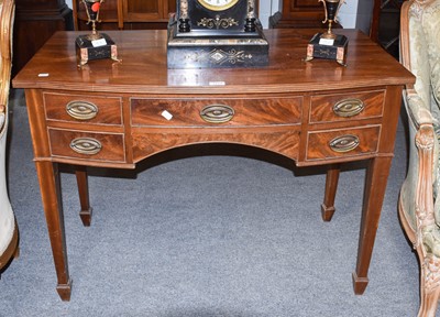 Lot 1274 - A reproduction mahogany bow fronted sideboard...