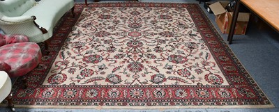 Lot 1009 - A machine made carpet of Oriental design, the...