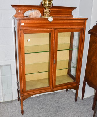 Lot 1259 - An Edwardian inlaid mahogany display cabinet,...