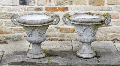Lot 505 - A Pair of Cast Stone Campana Shaped Urns, in...