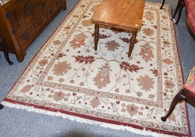 Lot 1178 - Afghan rug, the ivory field of vines enclosed...