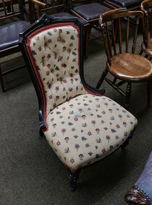 Lot 1140 - An Aesthetic period ebonised nursing chair...