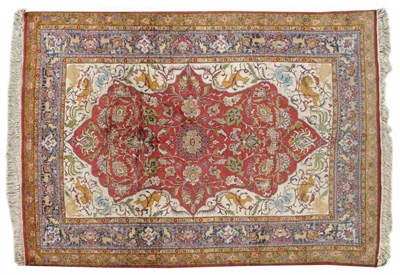 Lot 1101 - Lahore Carpet of Mughal Design Punjab The blood red field of scrolling vines enclosed by...