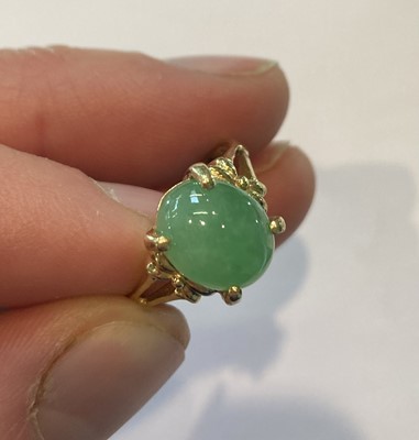 Lot 191 - A jade type pendant on an 18 carat gold chain;...