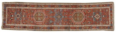 Lot 1102 - Narrow Karajah Runner  Persian Azerbaijan The terracotta field with a column of hooked and...