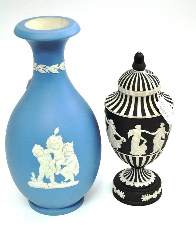 Lot 47 - A Wedgwood black and white jasper urn and cover, and a Wedgwood blue jasper vase (2)