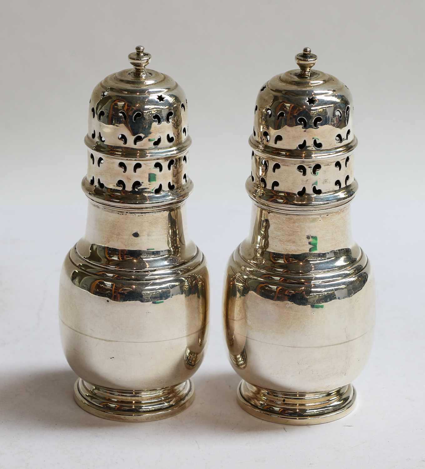 Lot 75 - A Pair of George V Silver Casters, by...