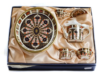 Lot 291 - A boxed Royal Crown Derby Dolls tea set on a...