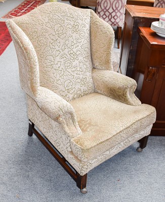 Lot 1124 - A pair of oak framed upholstered wingbacked...