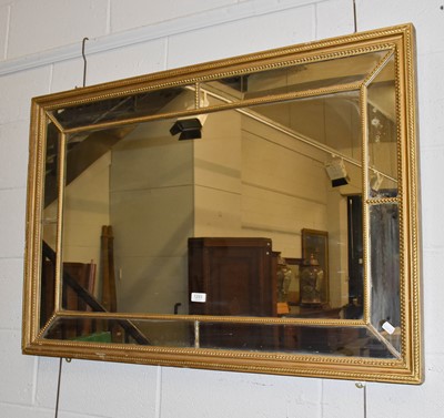 Lot 1293 - A Regency gilt-framed sectional mirror, 78cm...